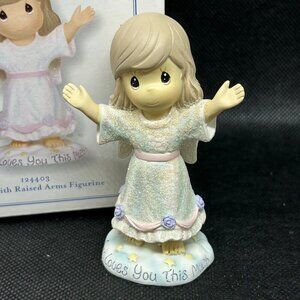 Precious Moments "God Loves You This Much" figurine